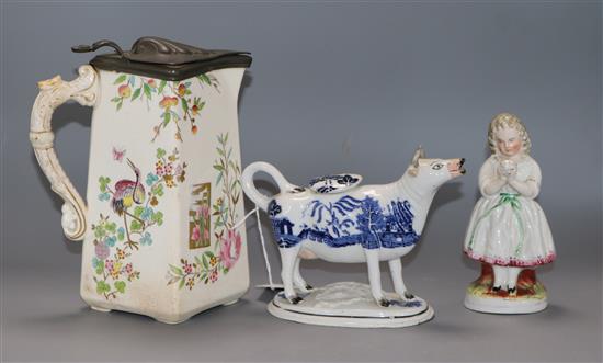 A Staffordshire Willow pattern cow creamer (a.f.), a Staffordshire figure and a jug tallest 22cm